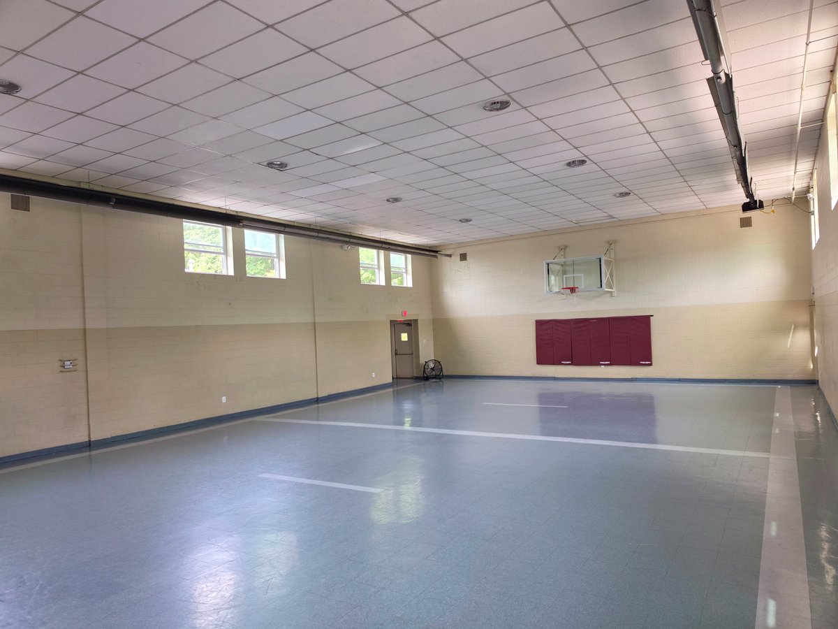 Messiah UMC gymnasium with basketball hoop and open floor space