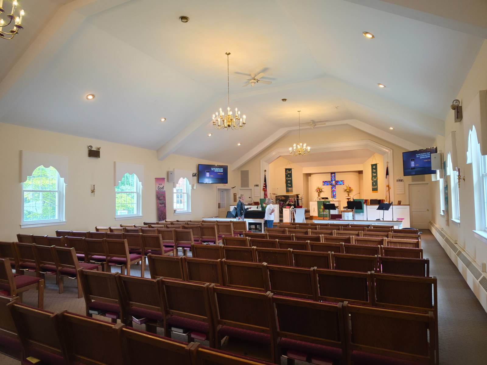 Messiah UMC sanctuary interior with stained glass cross at altar